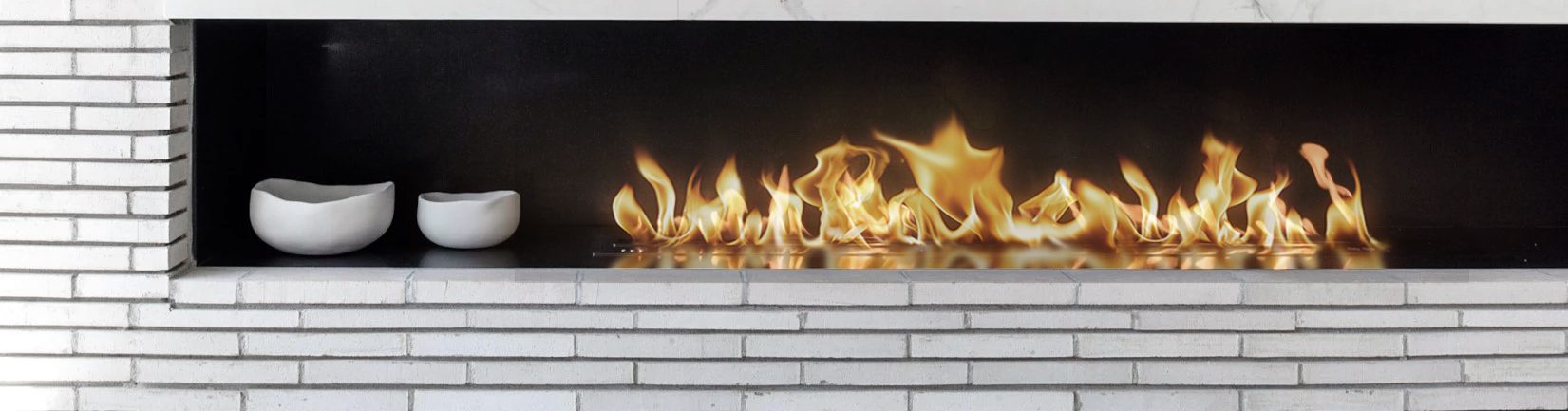 A fireplace with flames burning in it.